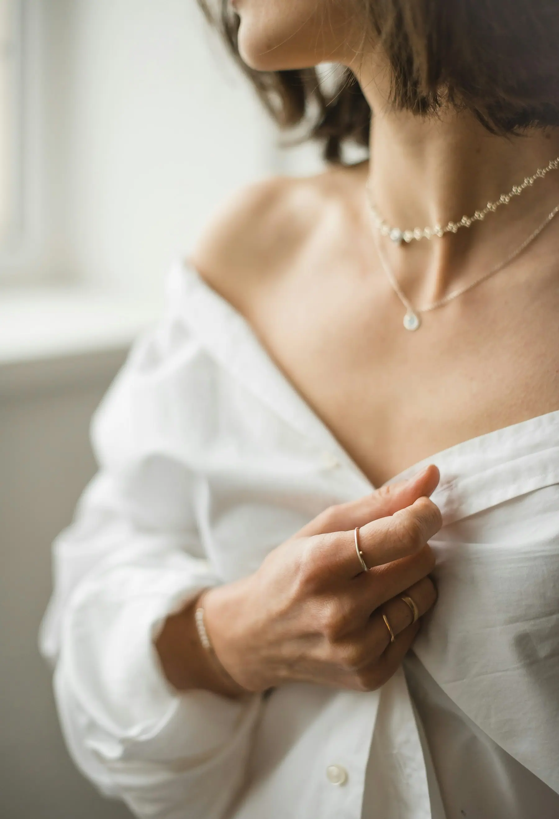 Fine jewellery worn with a soft white shirt