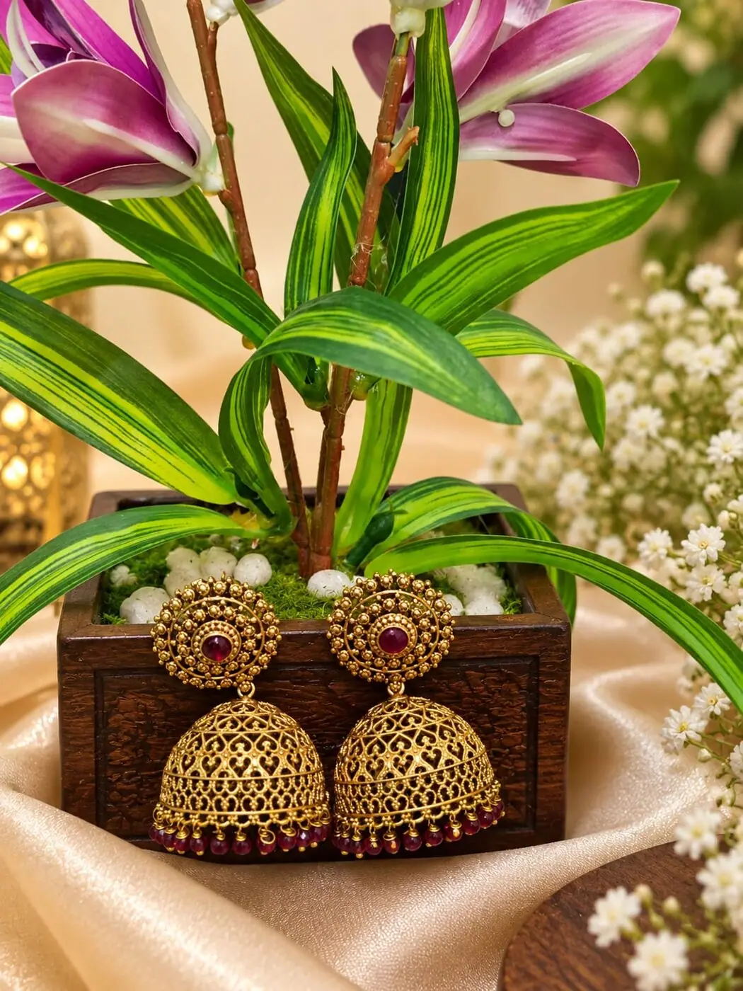 Bhuvana Temple Jhumkas, photographed on a display stand