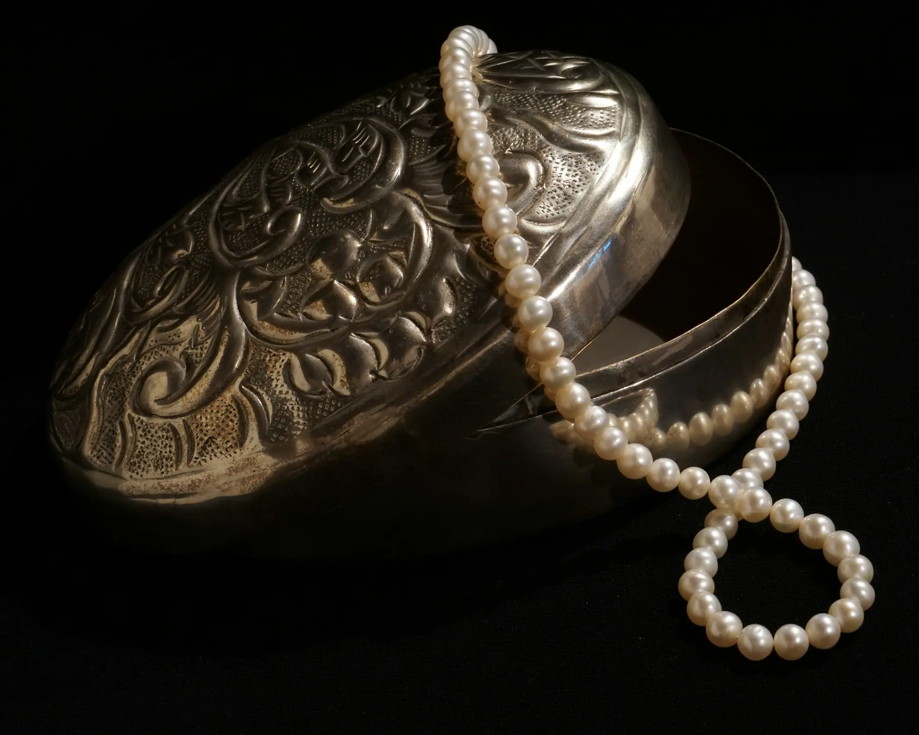 Warm-toned pearls gathered closely, showing surface lustre